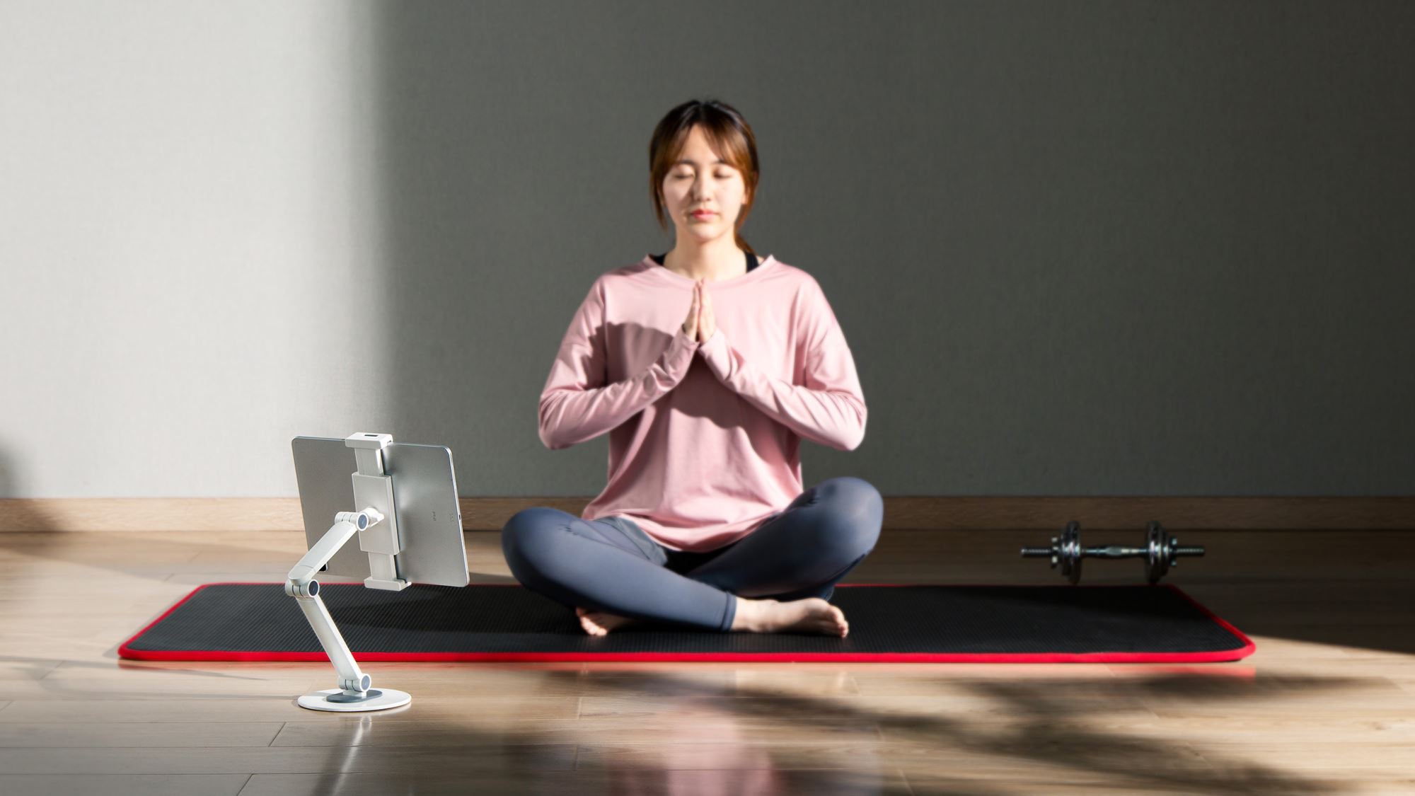 Kiki using white tablet holder exercising