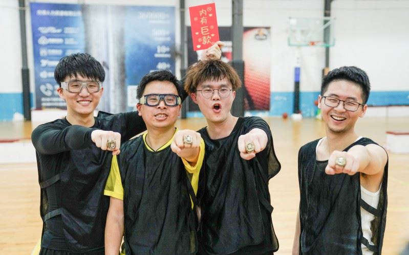 team black wearing championship rings to celebrating their success